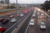 The M1 in Johannesburg, South Africa during rush hour as it passes through the suburb of Sandton. Like most former British colonies in Africa, South Africa drives on the left.