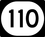 An elongated "circular" highway shield for route 110