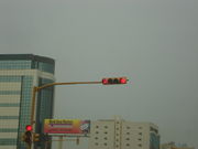 This traffic light in Khobar is video camera-actuated (just above the vertical light) and also shows the seconds remaining to change to the next state (in the horizontal light)