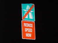 A Singaporean sign asking motorists to slow down