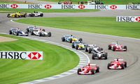 Cars wind through the infield section of the Indianapolis Motor Speedway at the 2003 United States Grand Prix