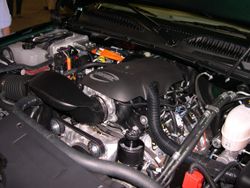 Engine compartment of a 2006 GMC Sierra Hybrid