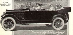 1920 Studebaker Big Six touring car with its top down. The folded top behind passengers was known as the "fan" when in the down position.