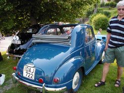 A Fiat 500 with top down.