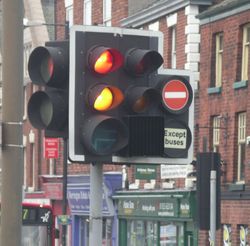 Traffic lights can have several additional lights for filter turns or bus lanes. This one in Warrington, also shows the distinctive red + amber combination seen in the UK.