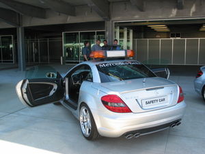 The F1 Safety Car outside of its garage in the pitlane at the 2005 US Grand Prix