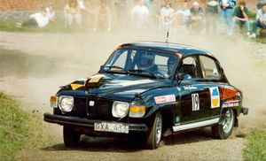 A Saab 96 V4 participating in a historic rally.