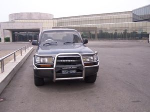 a RHD Toyota Landcruiser in front of a Pyongyang hotel