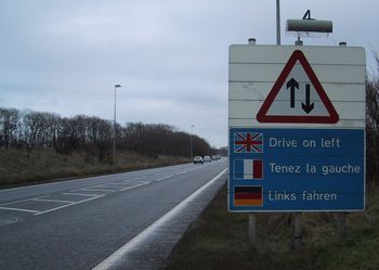 One of many road signs in the English county of Kent placed deliberately on the right hand side of the road