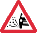 British sign warning of loose chippings on the road.