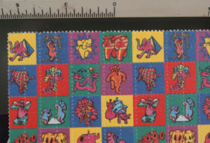 Perforated blotter paper impregnated with LSD, as illustrated above, is one popular form of dispensing the drug.