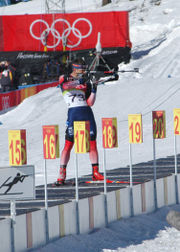 Jeremy Teela shoots from the standing position at the 2006 Winter Olympics.