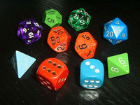 Typical role-playing dice, showing a variety of colors and styles. Note the older hand-inked green d12 (showing an 11), manufactured before pre-inked dice were common. Many players collect or acquire a large number of mixed and unmatching dice.