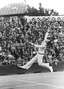 Bill Tilden hitting an overhead with classic form, circa 1925