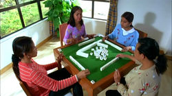 Four Filipino women playing Filipino Mahjong.