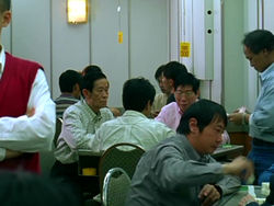 Mahjong houses provide a convenient venue for Mahjong old hands. This is a typical scene of Mahjong house in Wan Chai, Hong Kong.