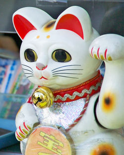 This maneki neko beckons customers to purchase takarakuji tickets in Tokyo, Japan.