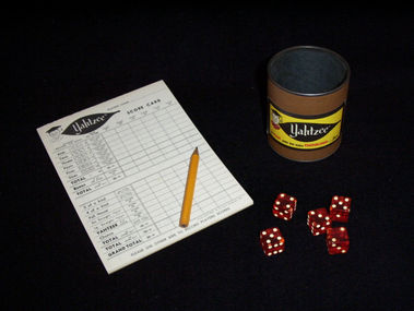 Cup, dice, pencil, and scorecard from 1961 Yahtzee Game