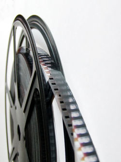 "Film" refers to the celluloid media on which movies are printed. This type of film here is 8 mm.