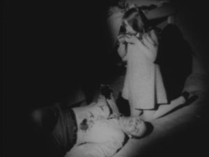 A young zombie and her victim, her father, from Night of the Living Dead (1968)