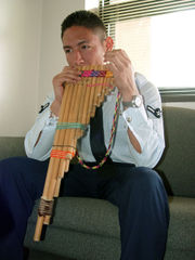 Playing the zampoa, an Inca instrument and type of pan pipes.