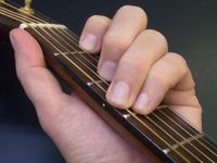 Fingering for a C-major trichord on a guitar in standard tuning (assuming all six strings are played).