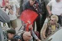 Punks at a music festival, displaying a variety of contemporary punk fashions.