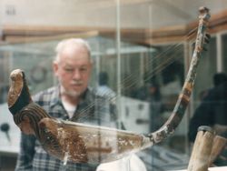 An ancient Egyptian harp on display in a UK museum.