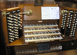 The  four-manual organ console at St. Mary Redcliffe church, Bristol, England. The organ was built by Harrison and Harrison in 1912 and restored in 1990.