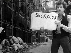 A frame from Bob Dylan's "Subterranean Homesick Blues" video.