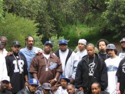 A sign of the west coast's unity. Ice Cube, Snoop Dogg, Daz, Daddy V, Kurupt, DJ Quik, Fredwreck, Dilated Peoples, Xzibit, Tyrese, Too Short, Warren G, Strong Arm Steady, Yo Yo, JT The Bigga Figga, B Real, WC, MC Eiht, Bishop Lamont, Glasses Malone, J Wells and Jelly Roll during a photoshoot for The Dogg Pound's new single Cali is Active, featuring cameo appearances by said artists.