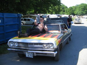 A raggare in his ideal environment, with a beer, on the hood of a 60's car (Picture taken during Power Big Meet in 2005)