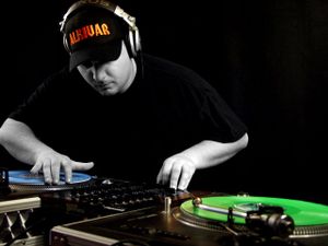 A disc jockey "scratching" a record.